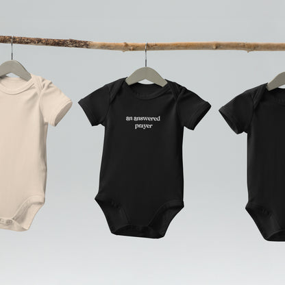 An Answered Prayer Organic Cotton Baby Onesie in Black